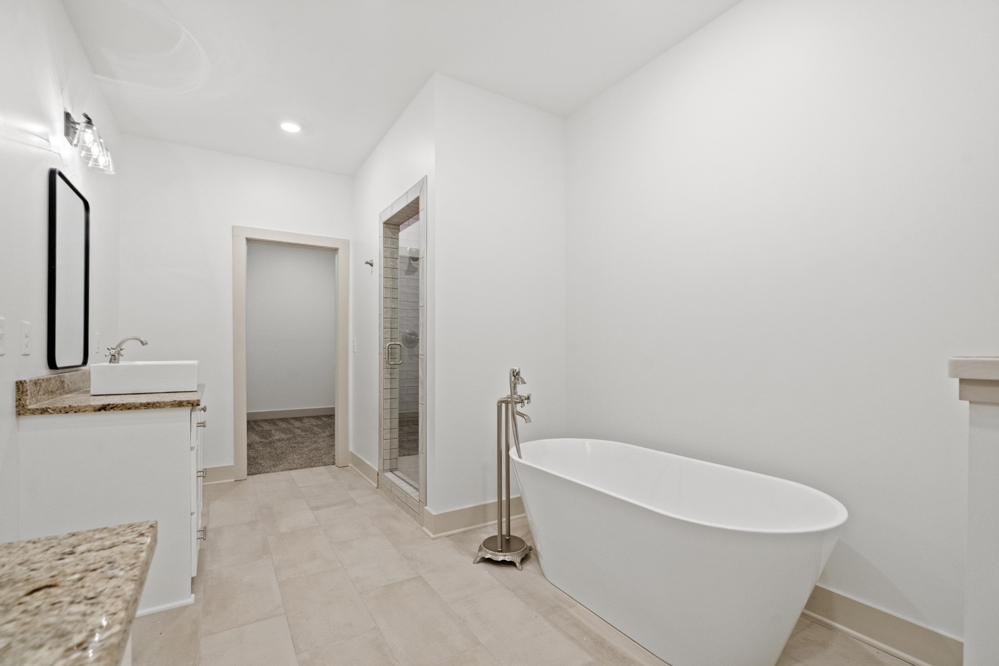 3390 Calista Road White House, TN 37188 - Photo 15 of 25 a bathroom with a granite countertop sink and a mirror