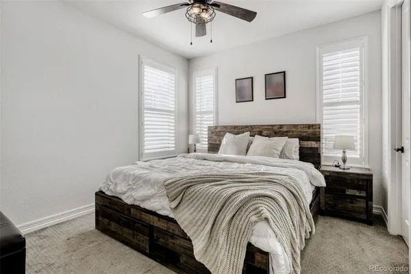 a bathroom with a sink toilet and mirror