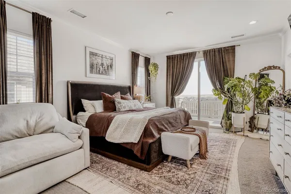 a bedroom with double bed and a flat screen tv