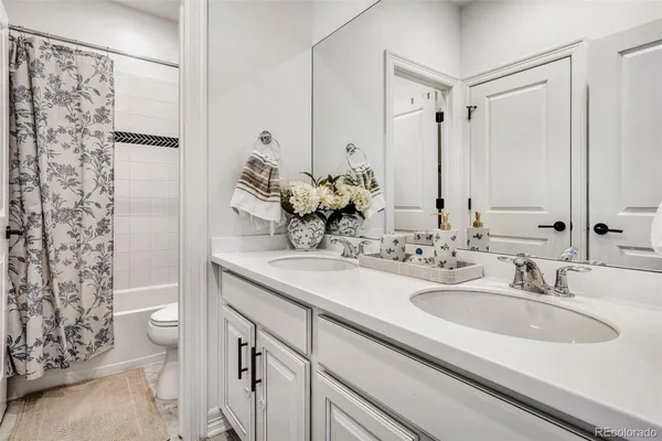 a bedroom with a bed and balcony view