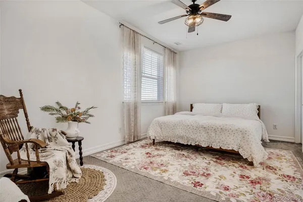 a large kitchen with a table and chairs