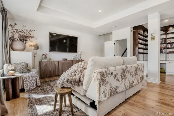 an empty room with wooden floor and a window