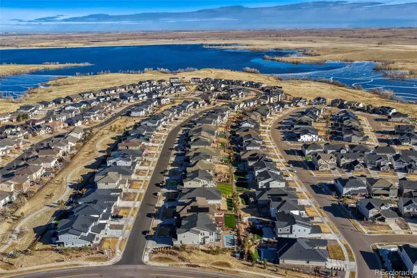 an aerial view of residential building and ocean