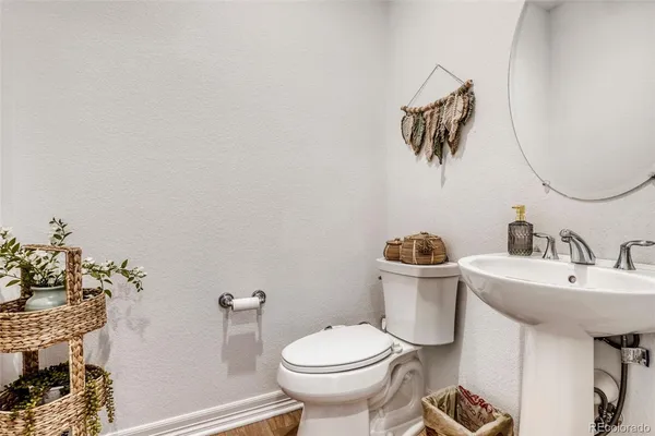 a bathroom with a toilet and a sink