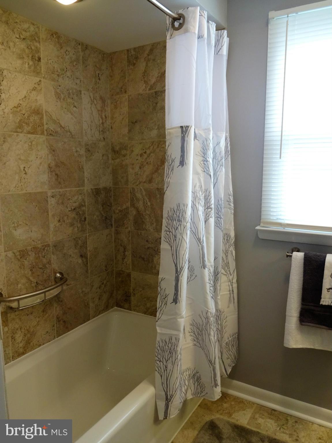 612 George Avenue Baltimore, MD 21221 - Photo 14 of 28 Main level Full Bath w/ Ceramic Tile