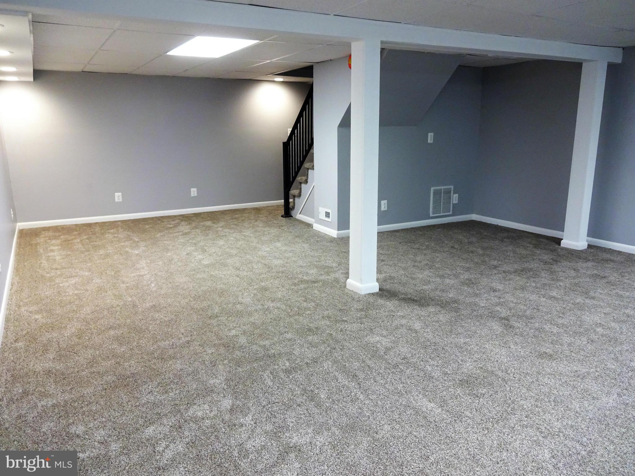 612 George Avenue Baltimore, MD 21221 - Photo 22 of 28 Large Family Room Offers New Carpeting