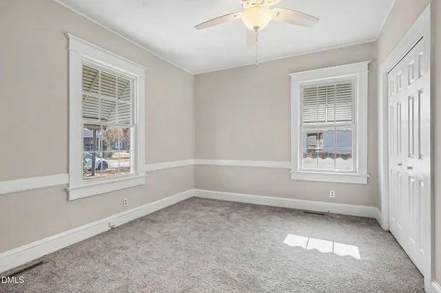 a view of an empty room with a window