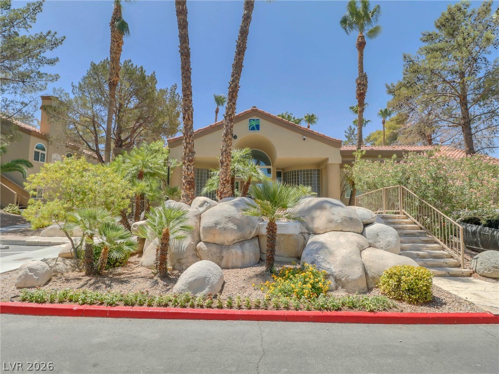 3145 East Flamingo Road, Unit 2129 Las Vegas, NV 89121 - Photo 34 of 43 Lush landscaping and stone accents enhance the inviting entry to this community structure.