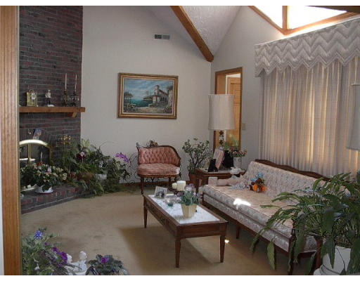 255 Ridge Street Arlington, MA 02474 - Photo 7 of 8 a living room with furniture and flowers