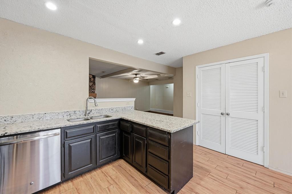1503 North Fielder Road Arlington, TX 76012 - Photo 12 of 40 a kitchen with a sink and cabinets