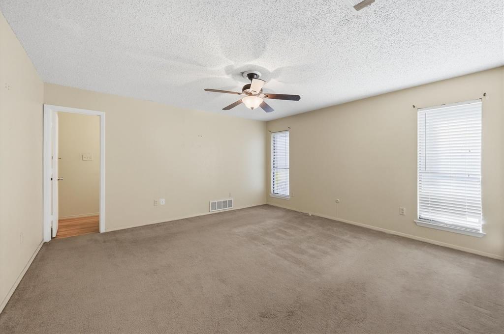 1503 North Fielder Road Arlington, TX 76012 - Photo 16 of 40 an empty room with fan and windows