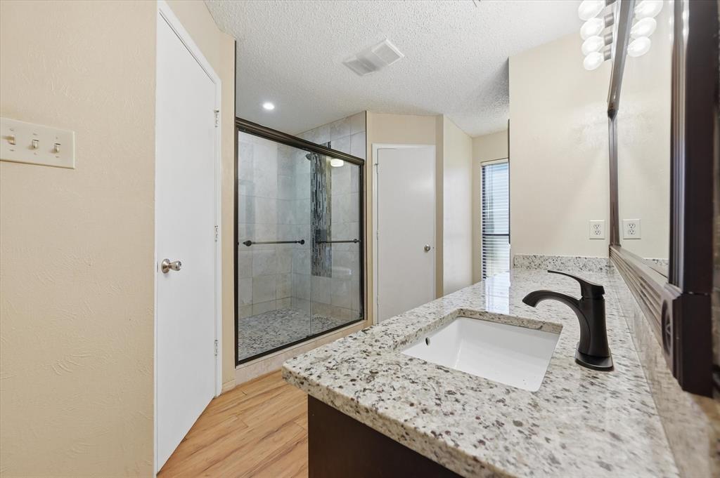 1503 North Fielder Road Arlington, TX 76012 - Photo 18 of 40 a bathroom with a sink and a mirror