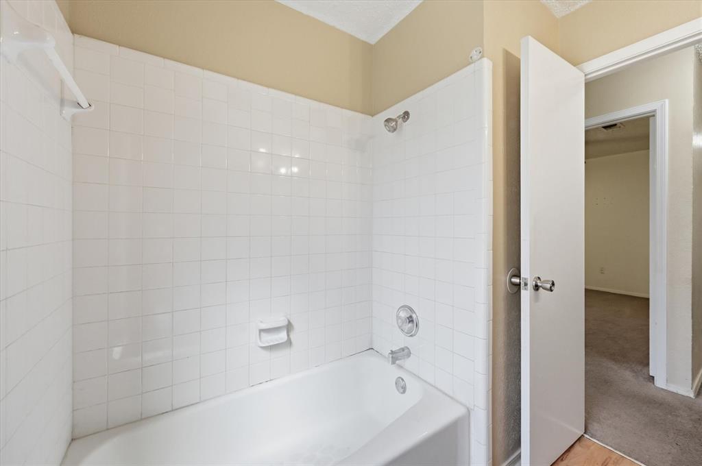 1503 North Fielder Road Arlington, TX 76012 - Photo 23 of 40 a bathroom with a bathtub and shower