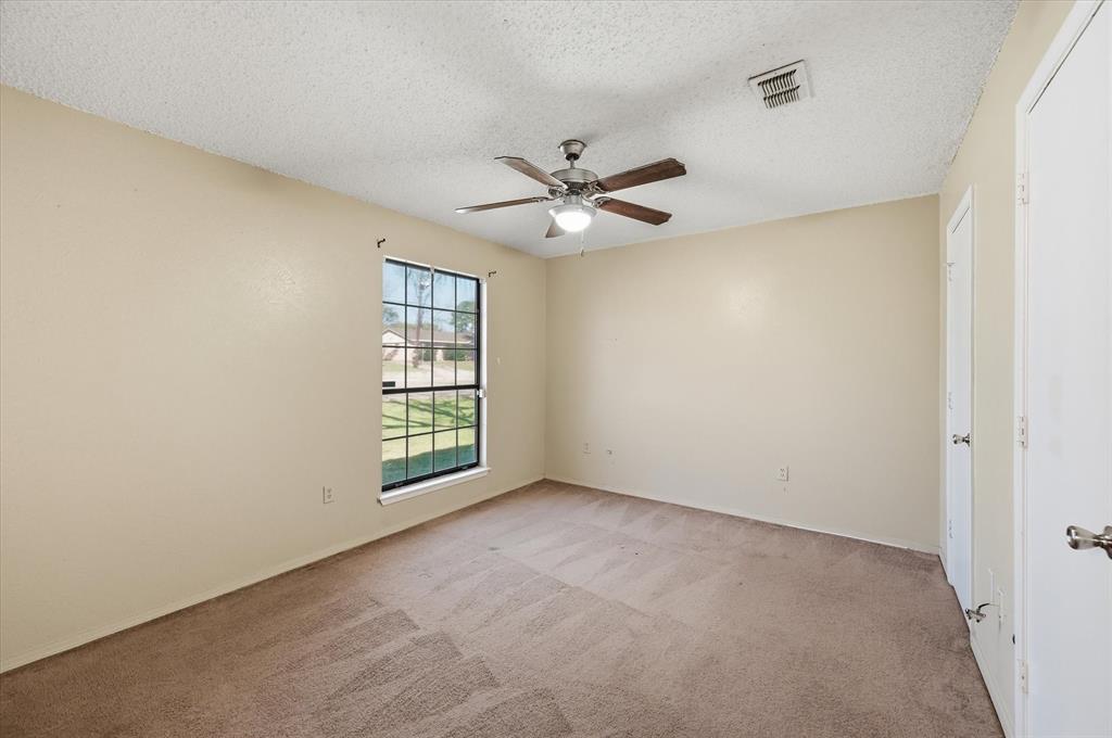 1503 North Fielder Road Arlington, TX 76012 - Photo 26 of 40 an empty room with windows and fan