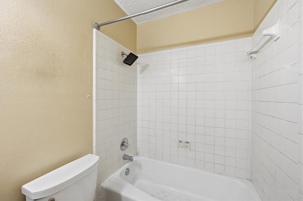 1503 North Fielder Road Arlington, TX 76012 - Photo 29 of 40 a bathroom with a shower and a toilet
