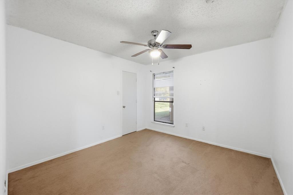 1503 North Fielder Road Arlington, TX 76012 - Photo 30 of 40 an empty room with windows and fan