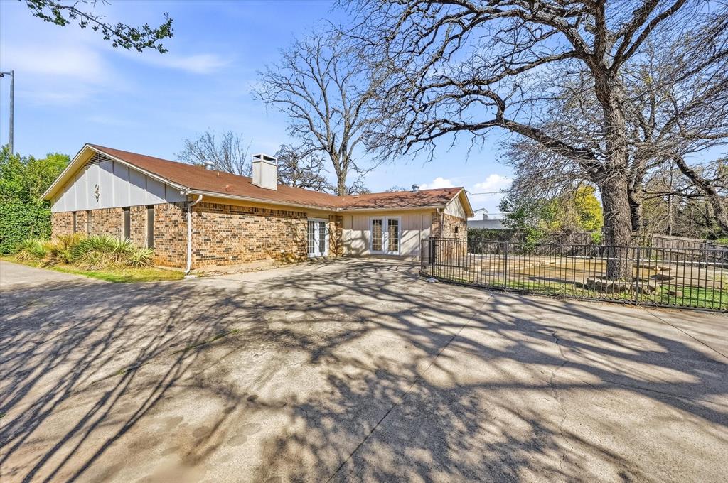 1503 North Fielder Road Arlington, TX 76012 - Photo 35 of 40 a front view of a house with a garden