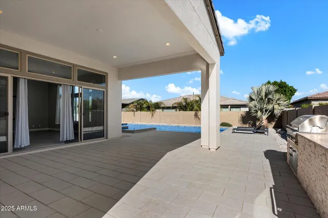 a view of a swimming pool with an outdoor seating