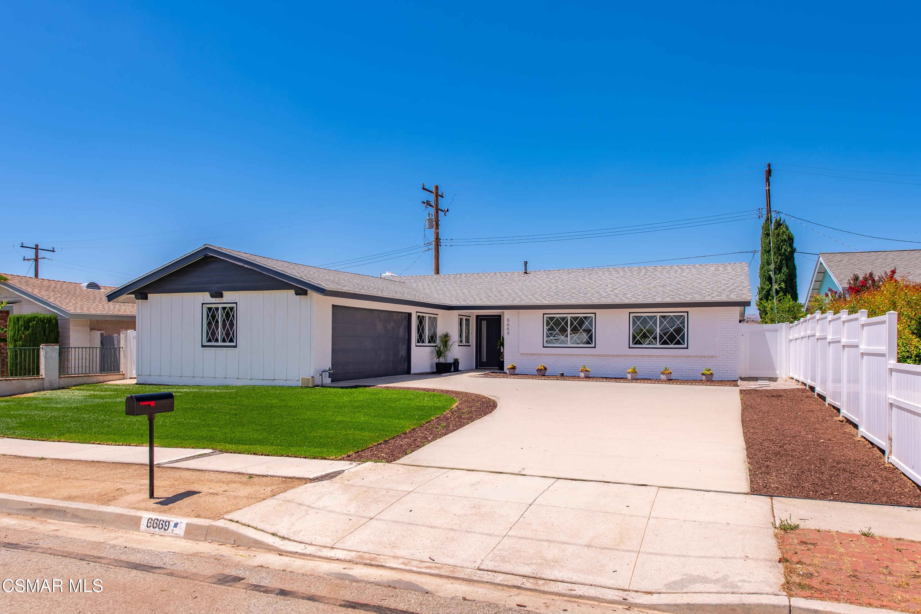 6669 Charing Street Simi Valley, CA 93063 - Photo 1 of 52 a view of a house with a yard and potted plants