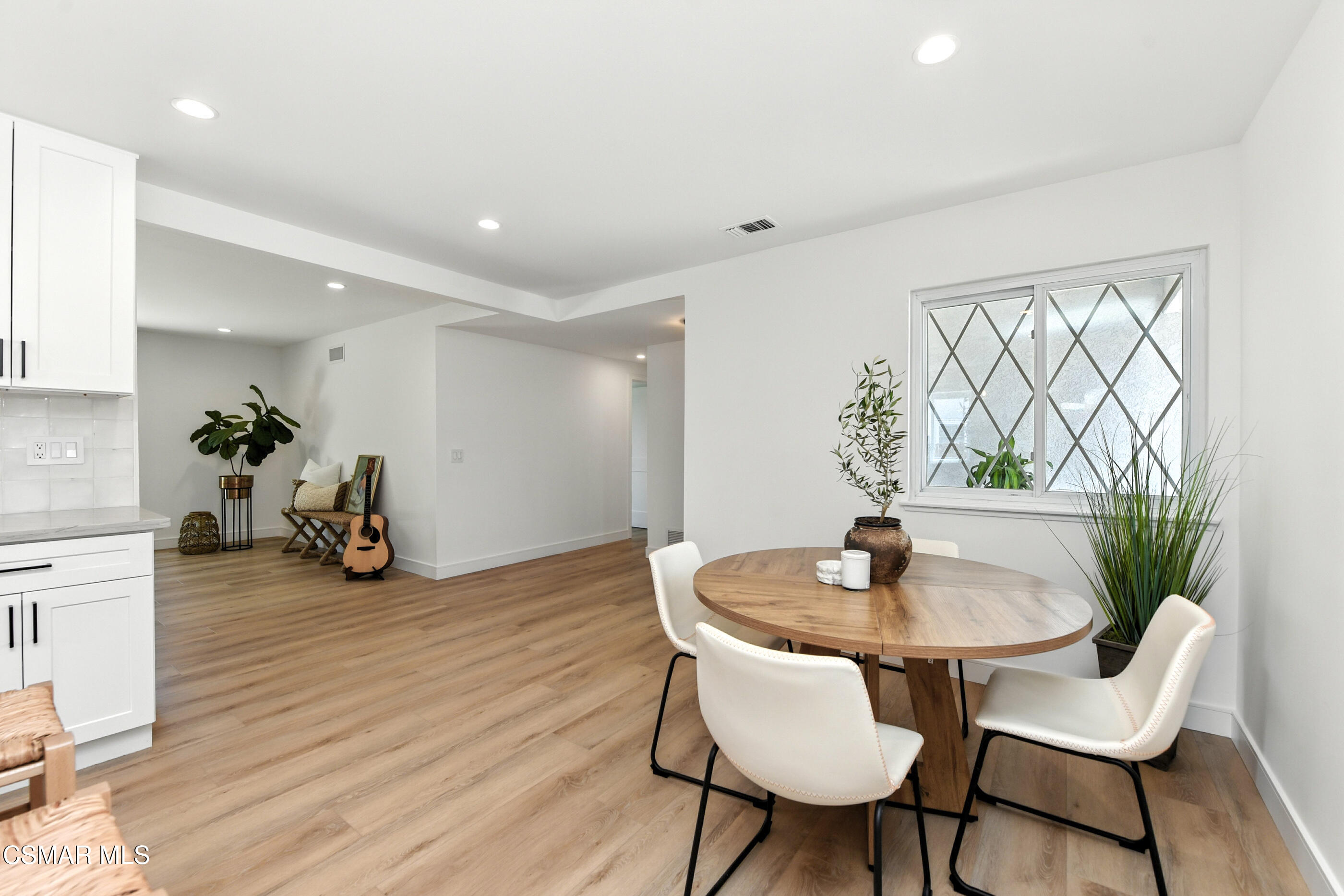 6669 Charing Street Simi Valley, CA 93063 - Photo 15 of 52 a view of a dining room with furniture and wooden floor