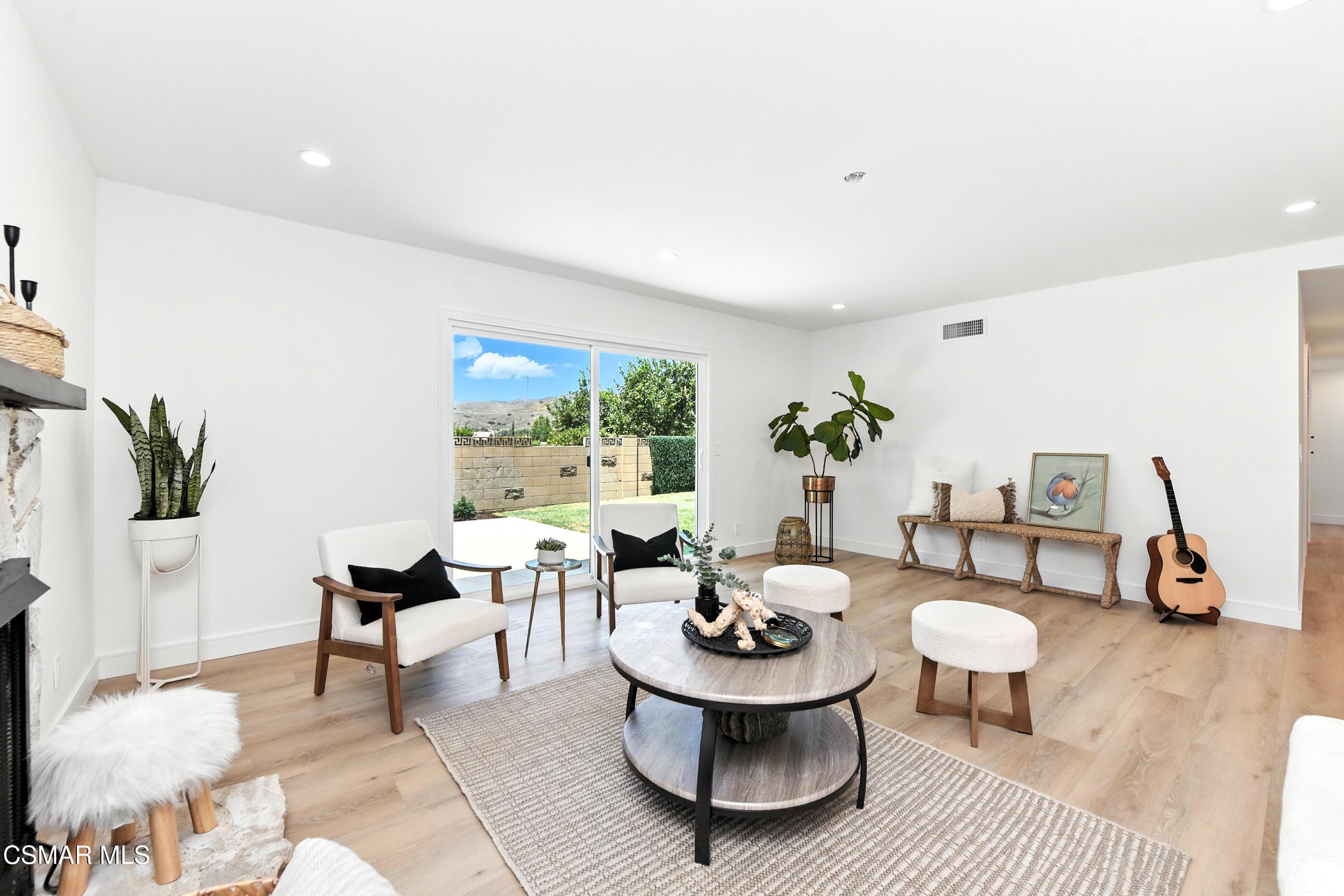 6669 Charing Street Simi Valley, CA 93063 - Photo 19 of 52 a living room with furniture and a table