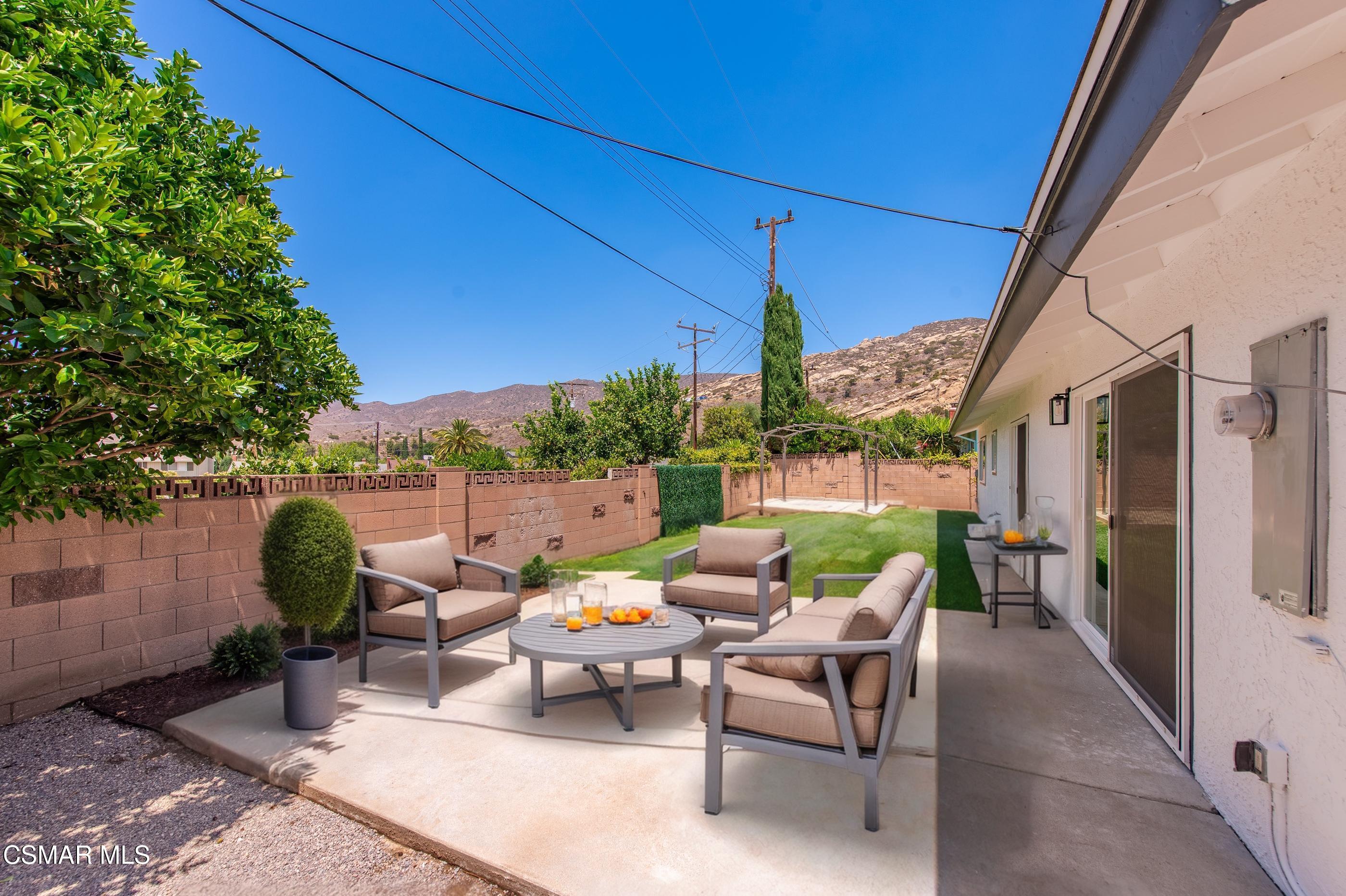 6669 Charing Street Simi Valley, CA 93063 - Photo 20 of 52 a patio with patio table and chairs