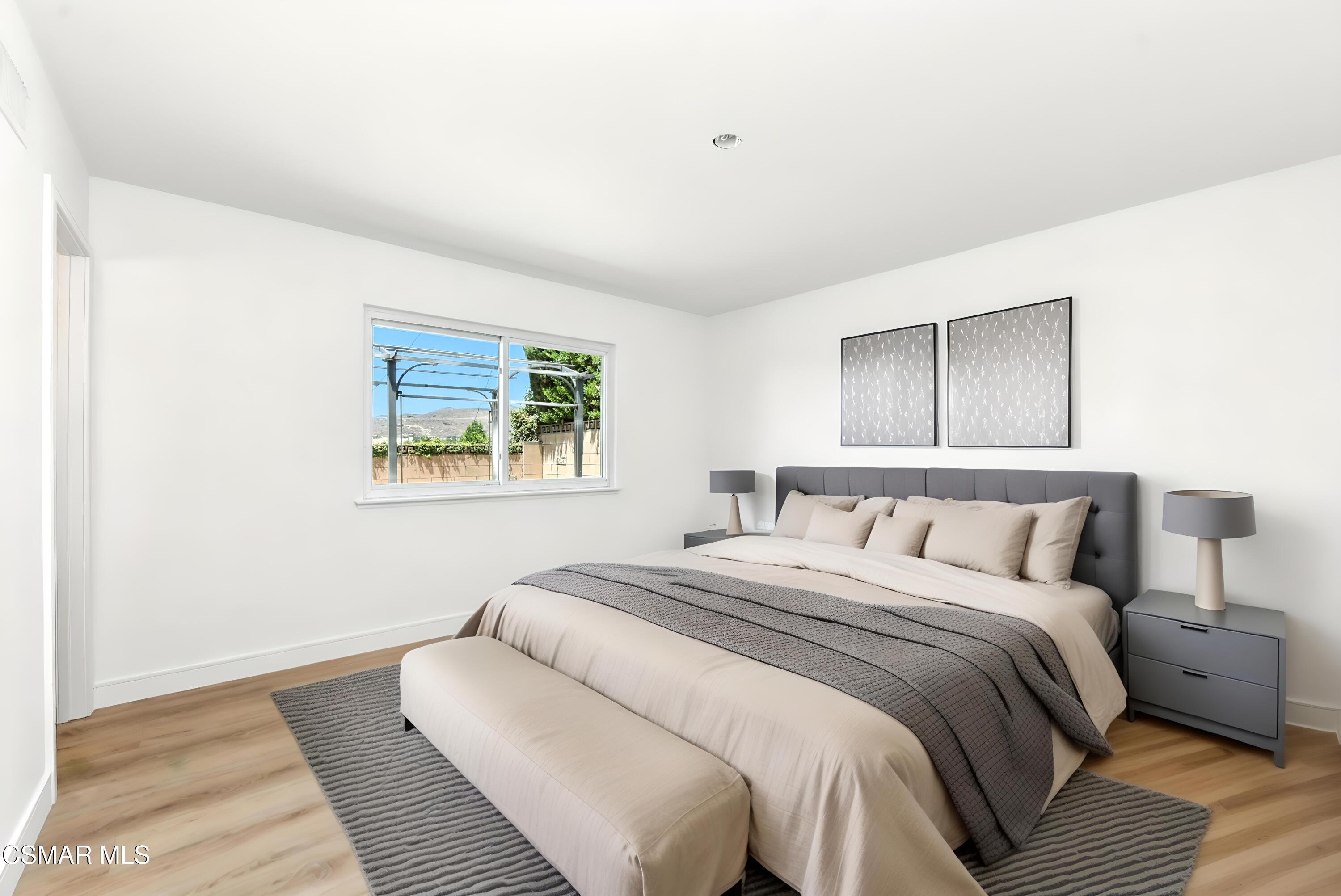 6669 Charing Street Simi Valley, CA 93063 - Photo 27 of 52 a bedroom with a bed and a window