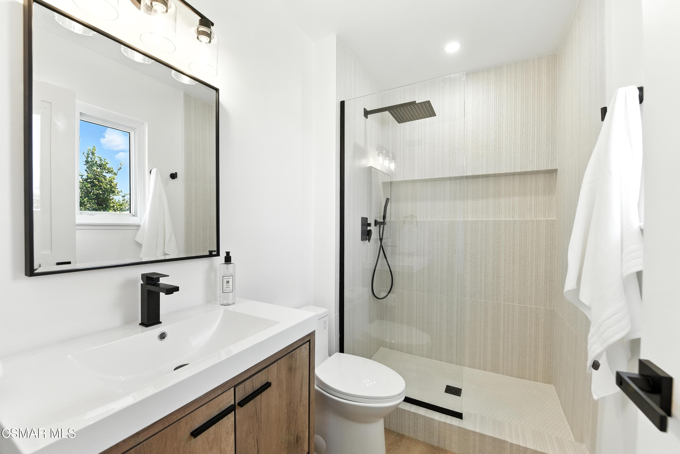 6669 Charing Street Simi Valley, CA 93063 - Photo 30 of 52 a bathroom with a sink toilet and shower