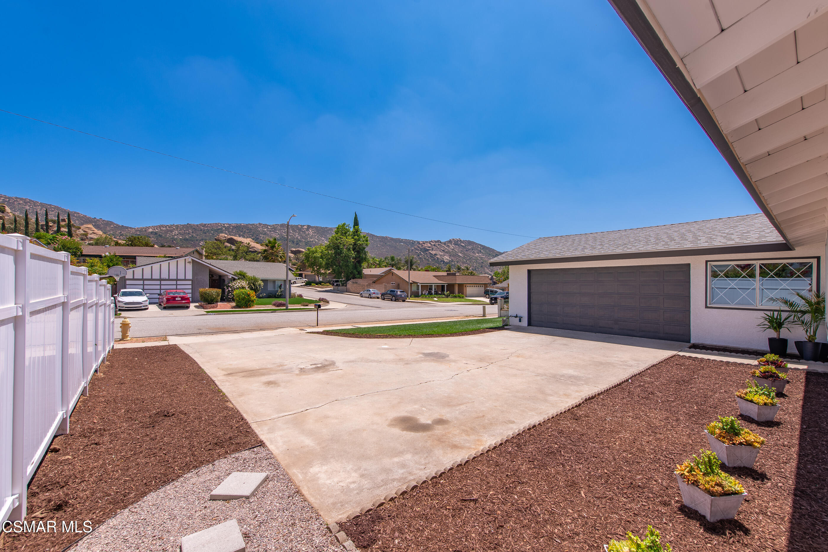 6669 Charing Street Simi Valley, CA 93063 - Photo 3 of 52 a view of a house with a yard