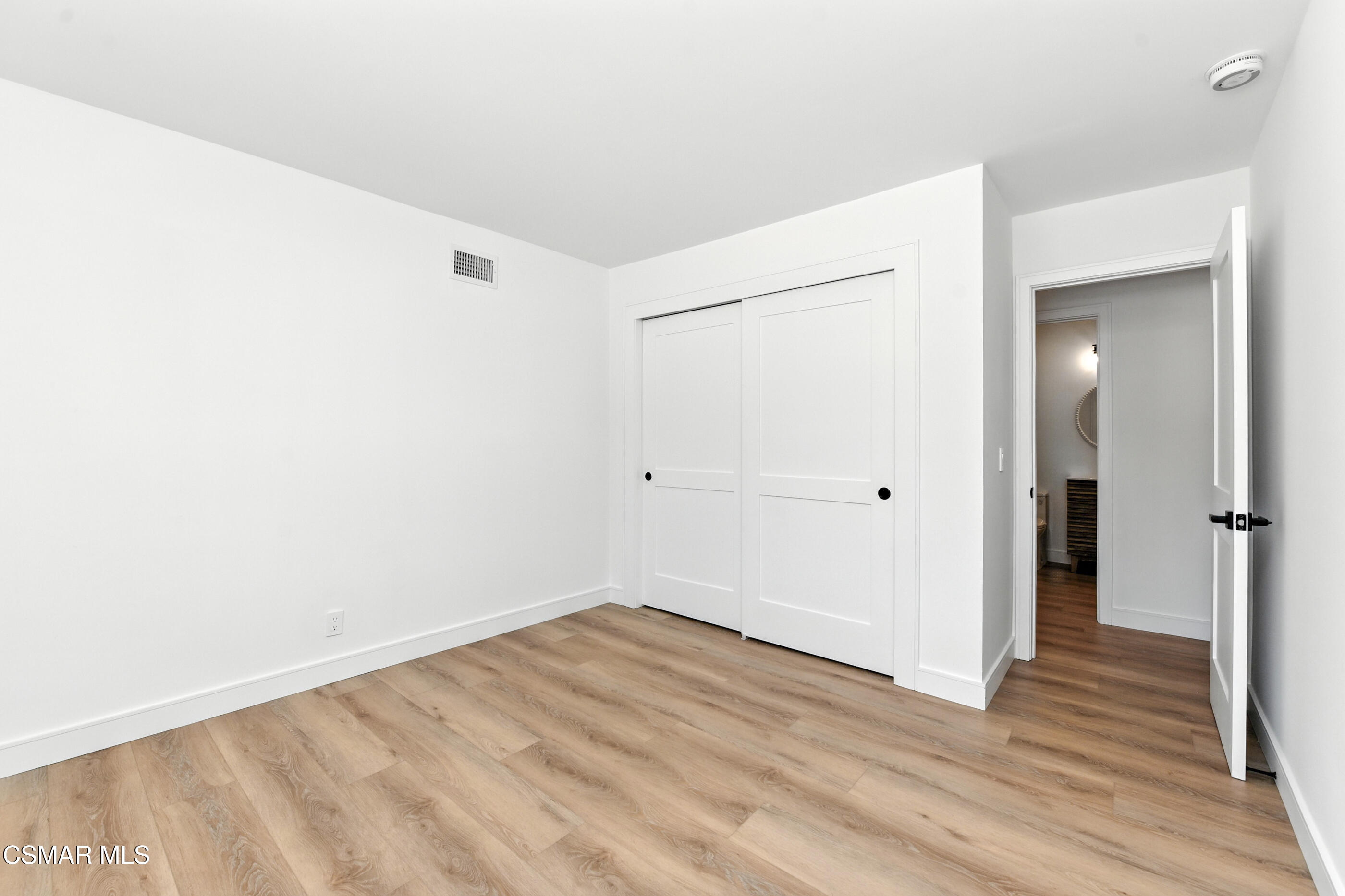 6669 Charing Street Simi Valley, CA 93063 - Photo 36 of 52 a view of a room with wooden floor
