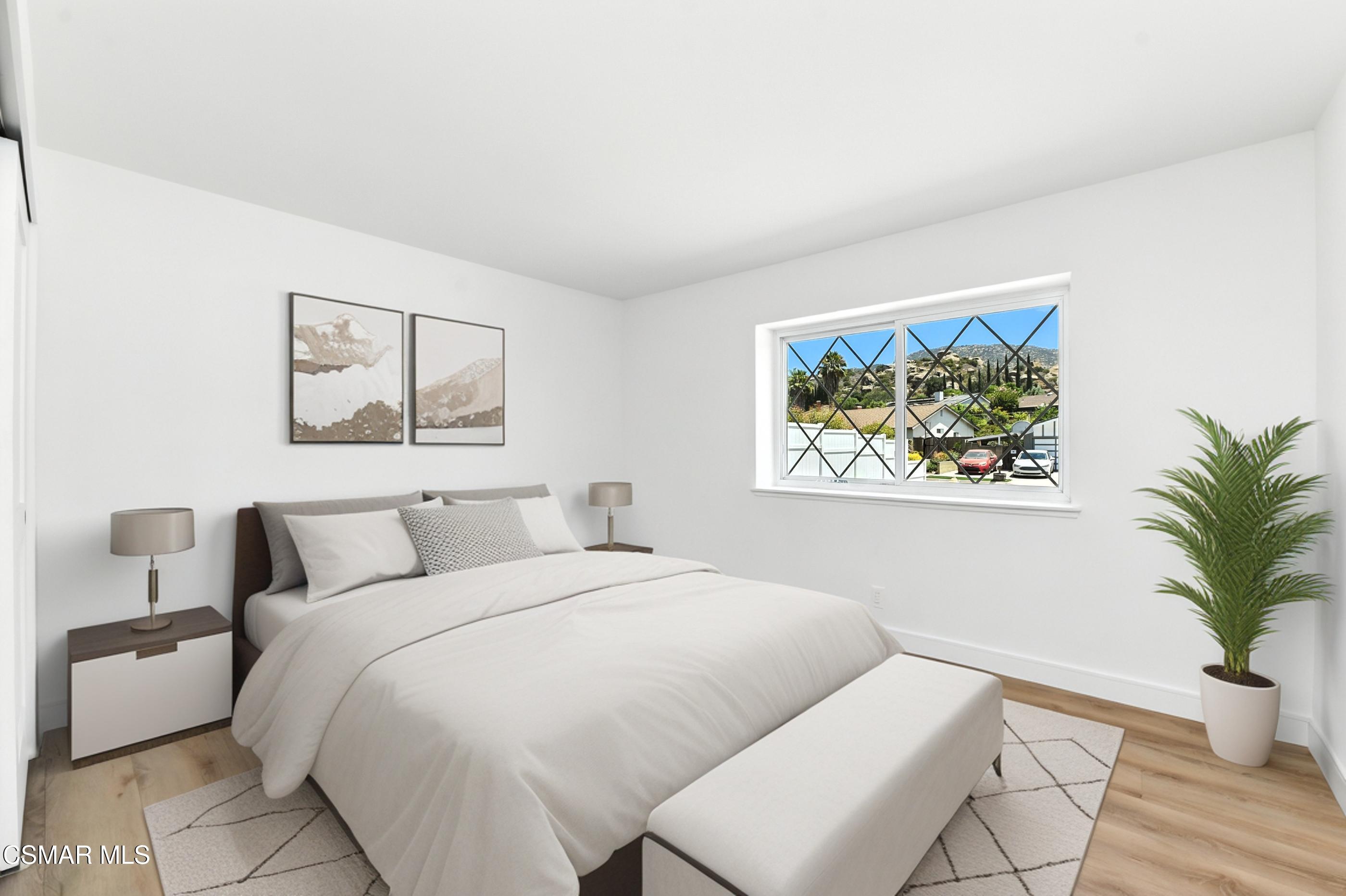 6669 Charing Street Simi Valley, CA 93063 - Photo 37 of 52 a bedroom with a bed and a painting on the wall