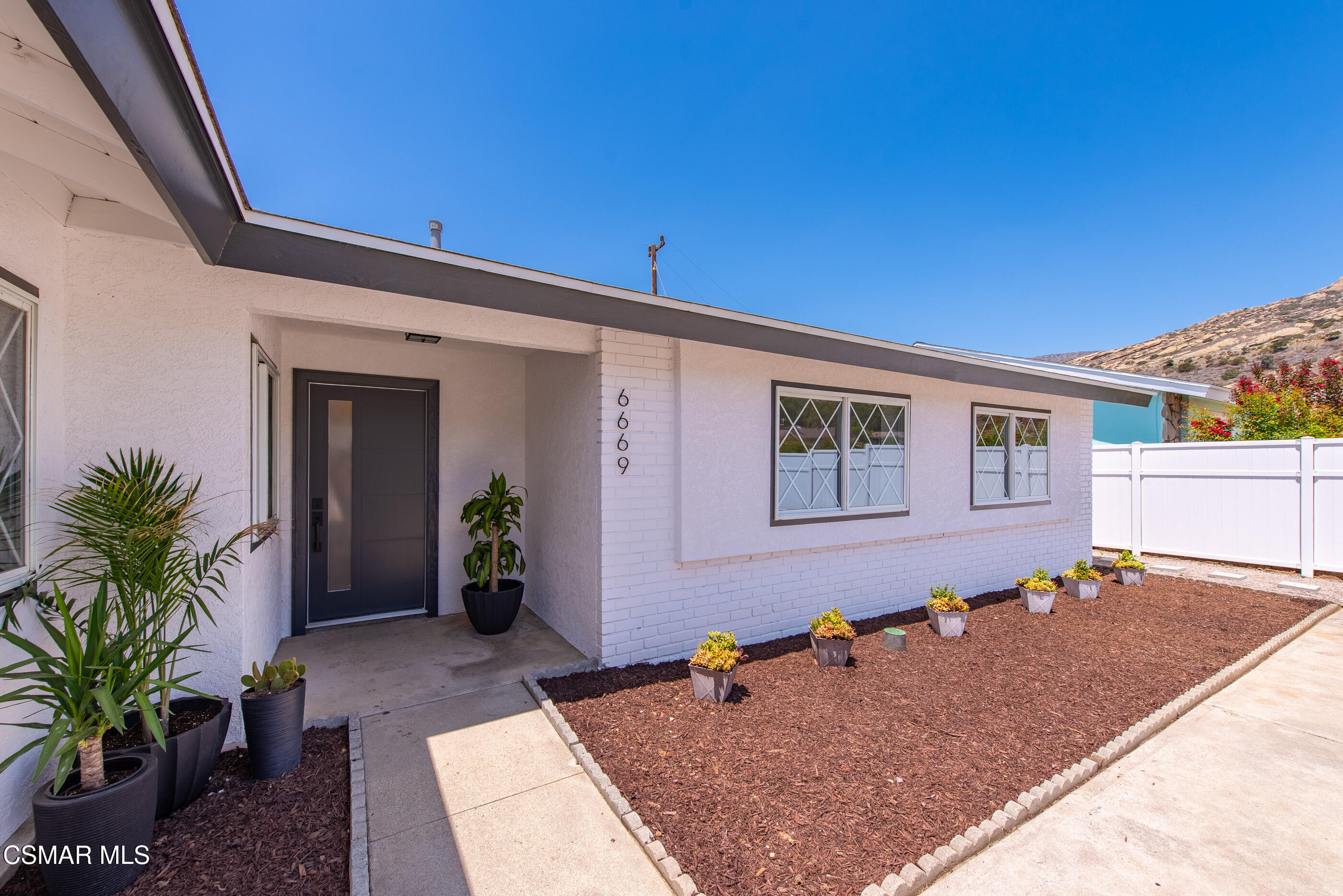 6669 Charing Street Simi Valley, CA 93063 - Photo 4 of 52 a backyard of a house with seating space