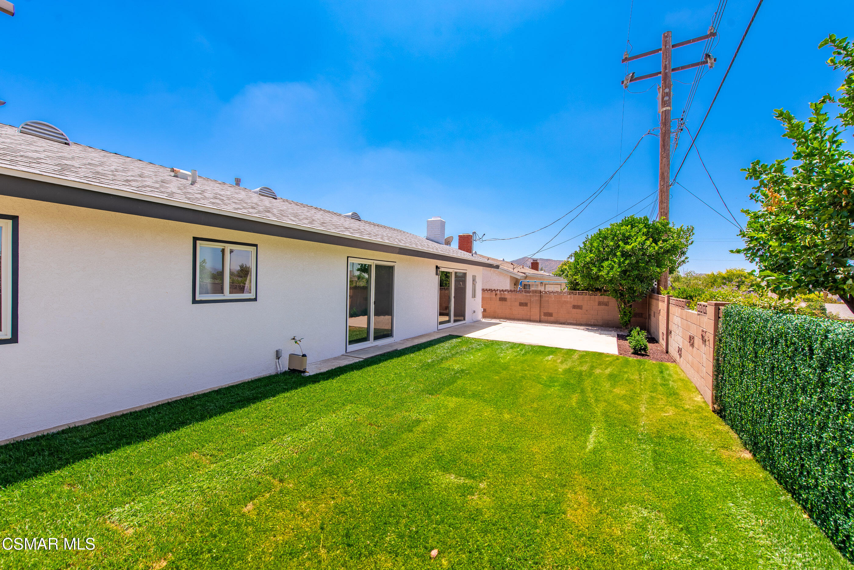 6669 Charing Street Simi Valley, CA 93063 - Photo 41 of 52 a backyard of a house with table and chairs