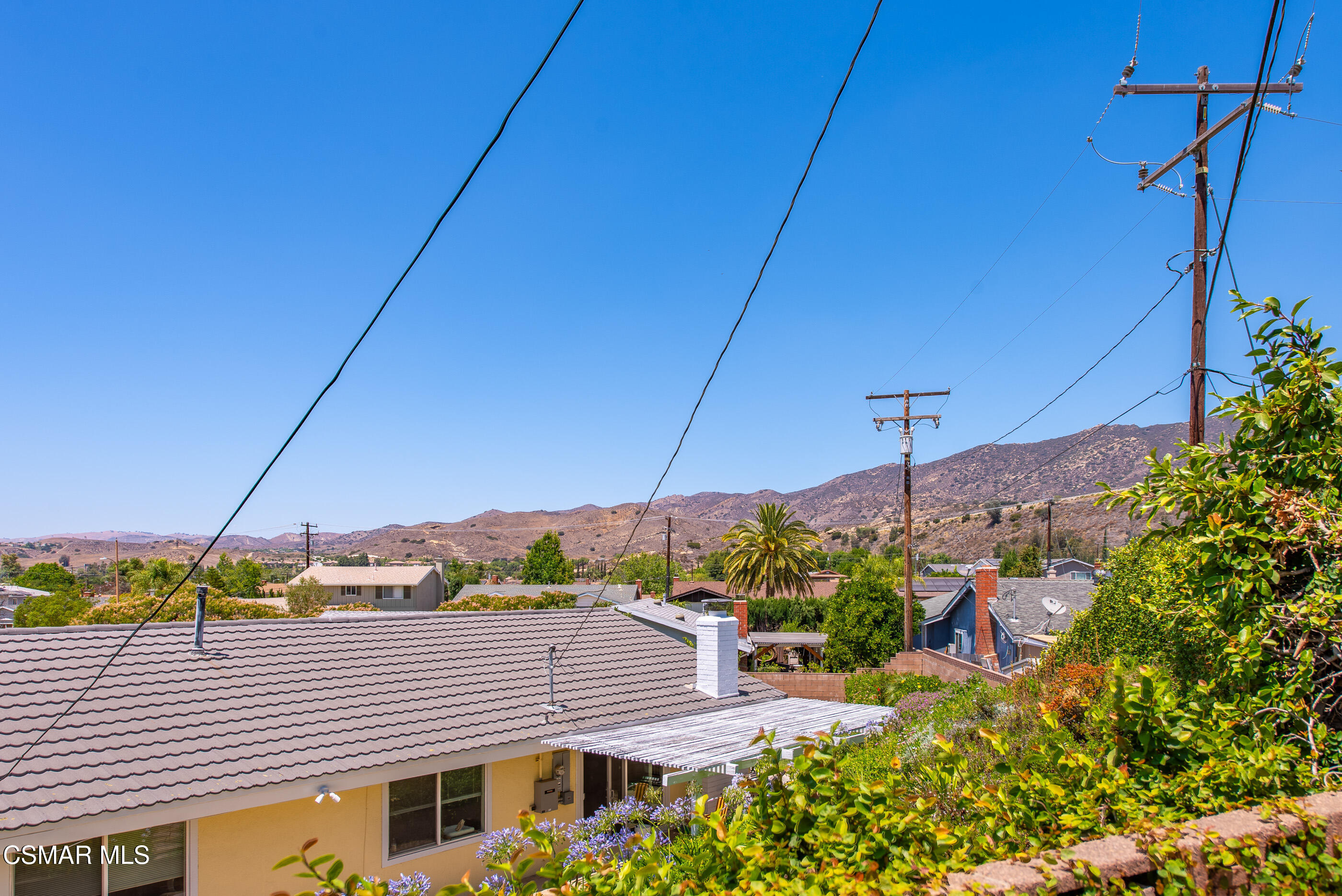 6669 Charing Street Simi Valley, CA 93063 - Photo 43 of 52 a view of a house with a yard and potted plants