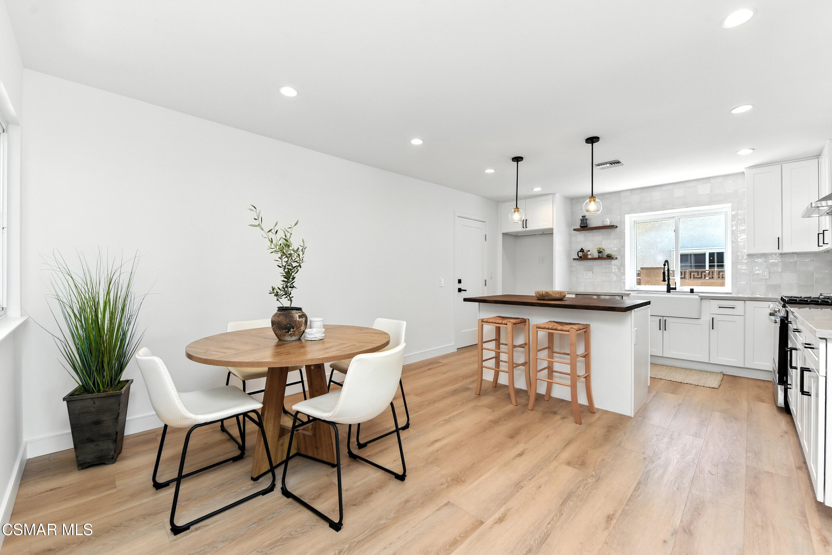 6669 Charing Street Simi Valley, CA 93063 - Photo 7 of 52 a kitchen with a table and chairs in it