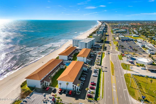 a view of swimming pool with an outdoor seating