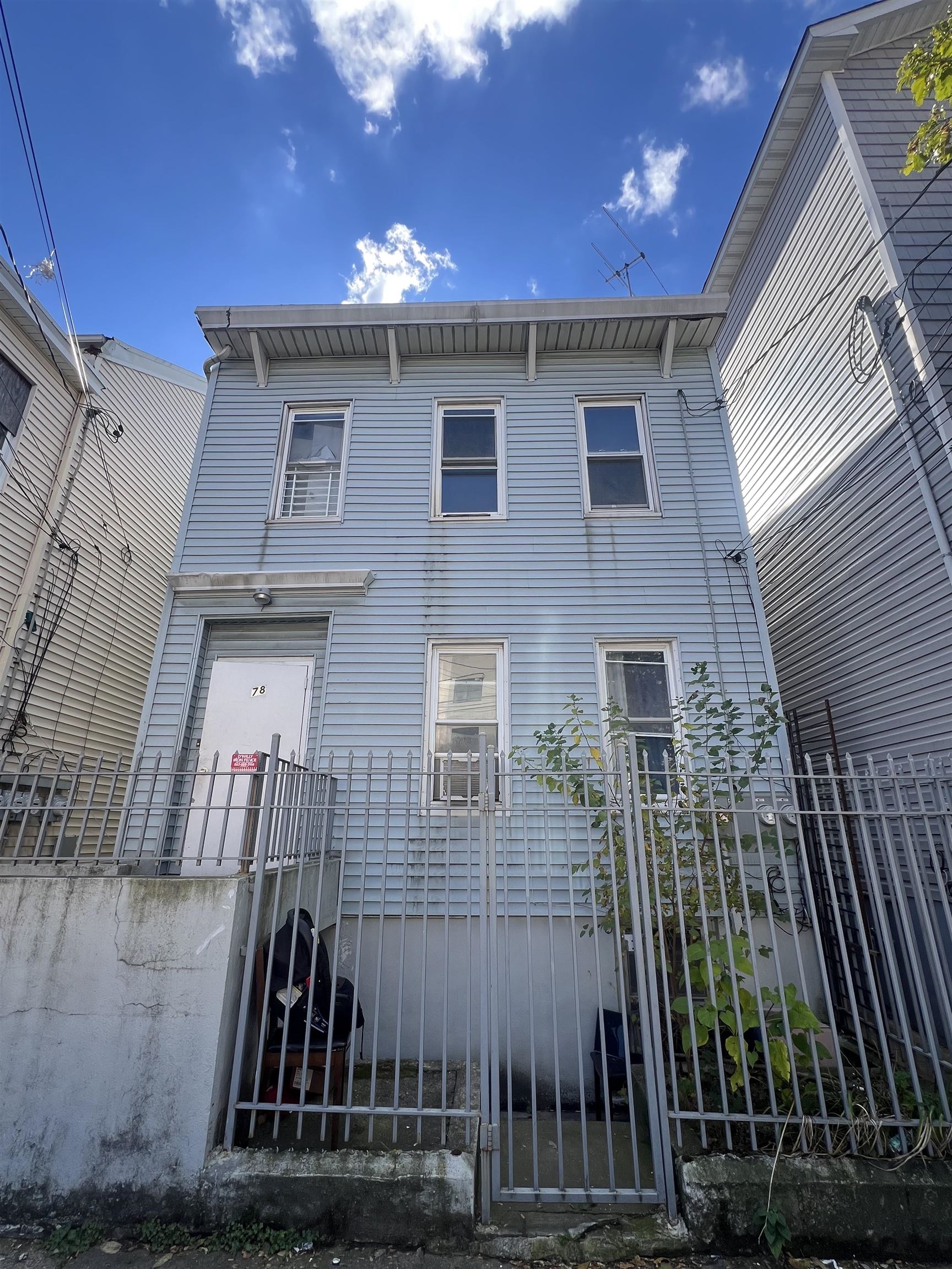 78 16th Avenue, Unit 2 Paterson, NJ 07501 - Photo 2 of 9 a view of a house with a backyard
