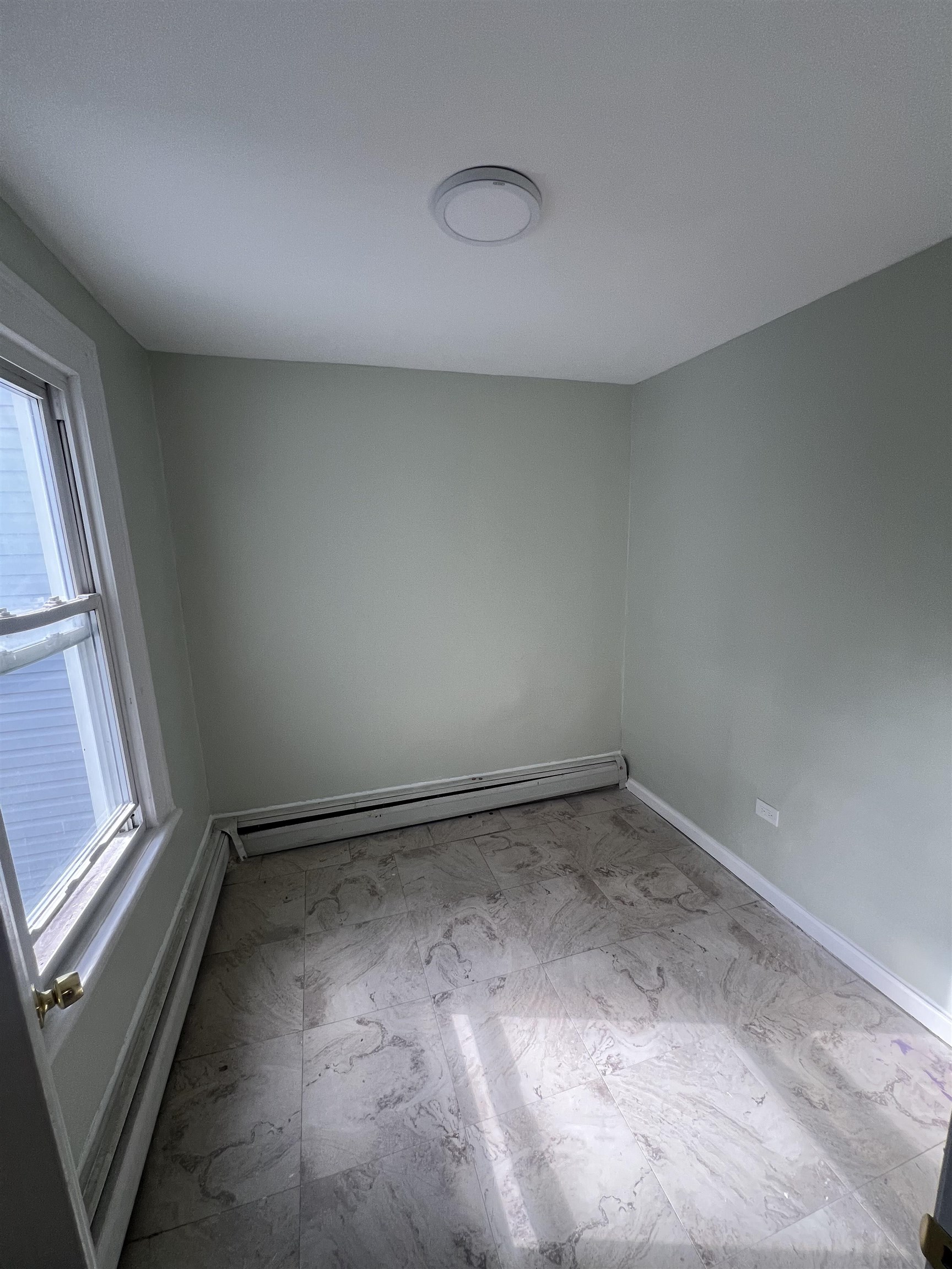 78 16th Avenue, Unit 2 Paterson, NJ 07501 - Photo 6 of 9 a view of an empty room and a window