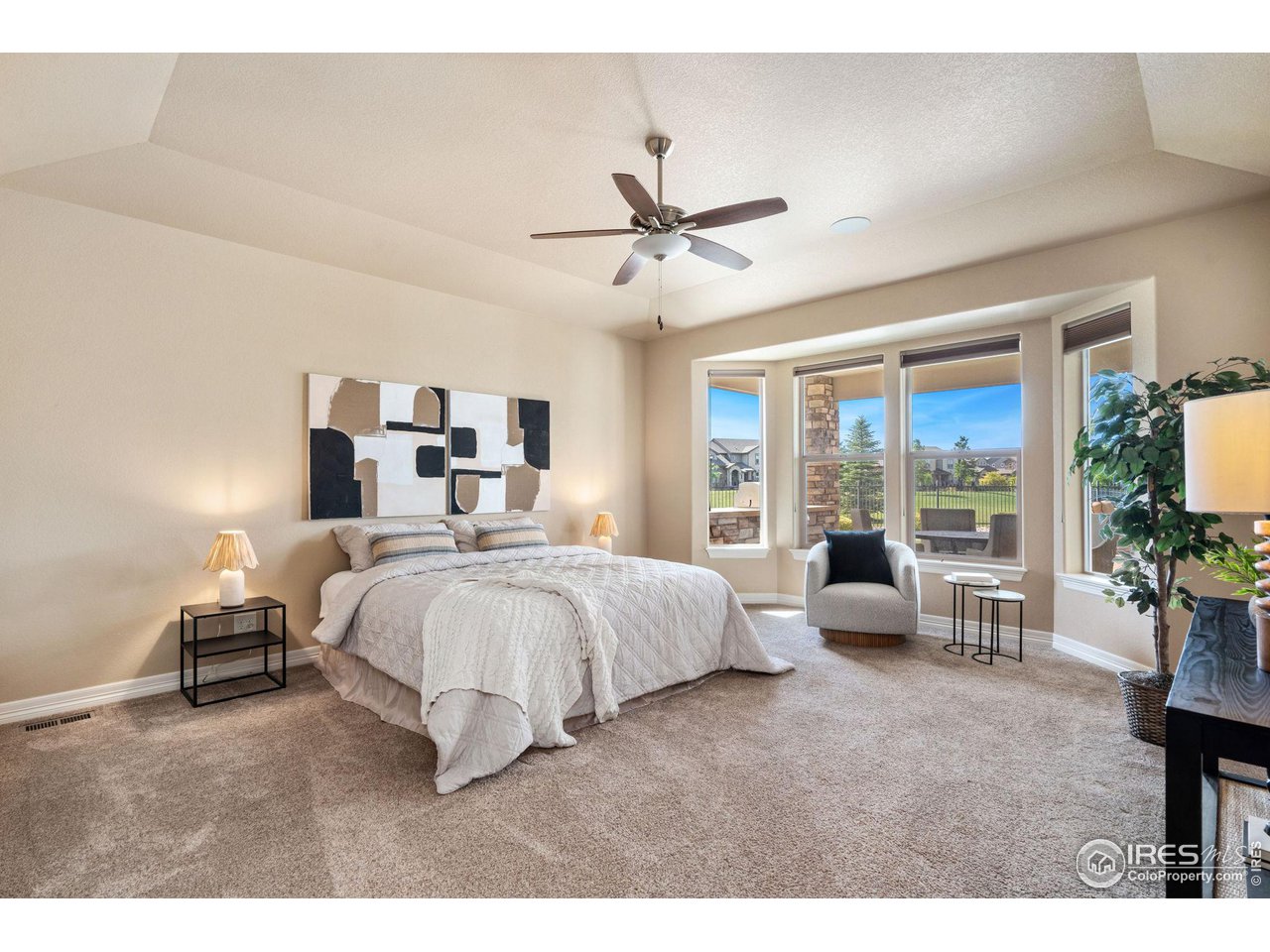 6740 Olympia Fields Court Windsor, CO 80550 - Photo 11 of 28 a bed room with a bed and a couch