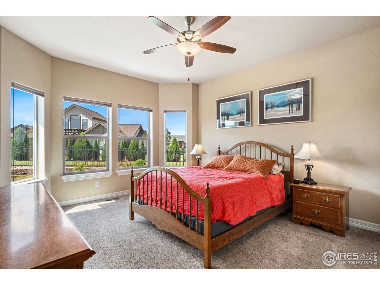 6740 Olympia Fields Court Windsor, CO 80550 - Photo 14 of 28 a bed room with a bed and a large window