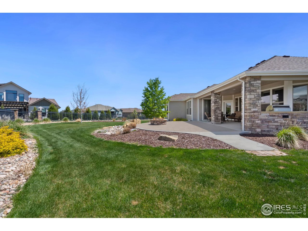 6740 Olympia Fields Court Windsor, CO 80550 - Photo 21 of 28 a view of a house with a yard