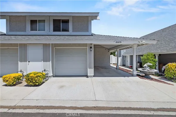 a front view of a house with a garage