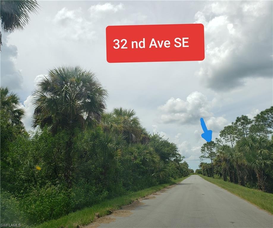 32nd Avenue Southeast Naples, FL 34120 - Photo 4 of 4 a sign that is on the side of a road