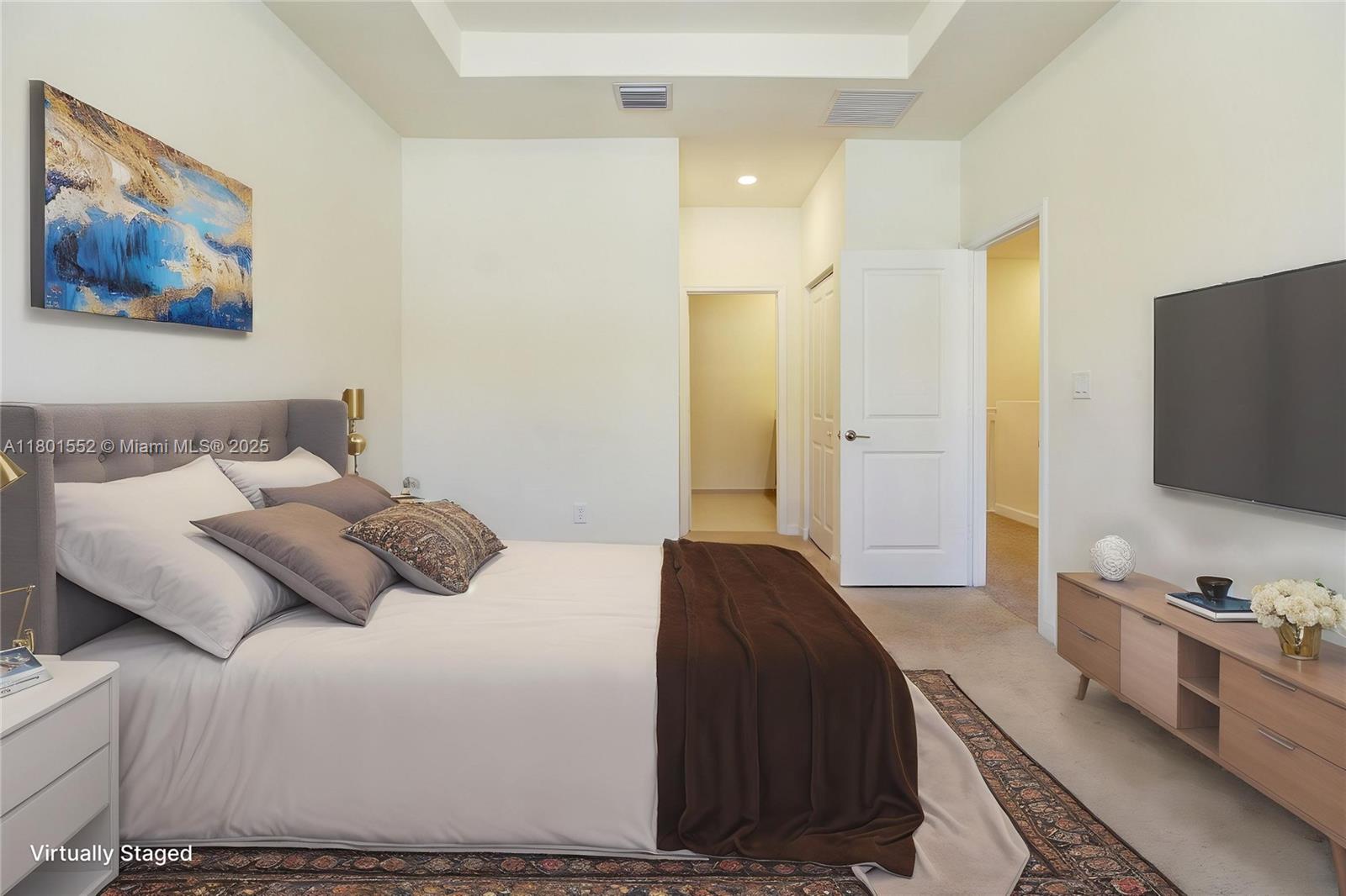 11094 West 33rd Way Hialeah, FL 33018 - Photo 20 of 46 a bedroom with a bed and a flat screen tv