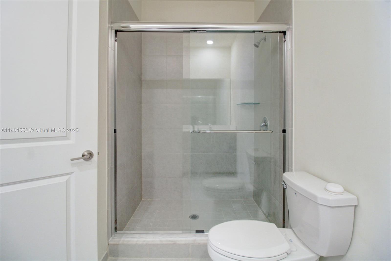 11094 West 33rd Way Hialeah, FL 33018 - Photo 25 of 46 a bathroom with a shower and a toilet
