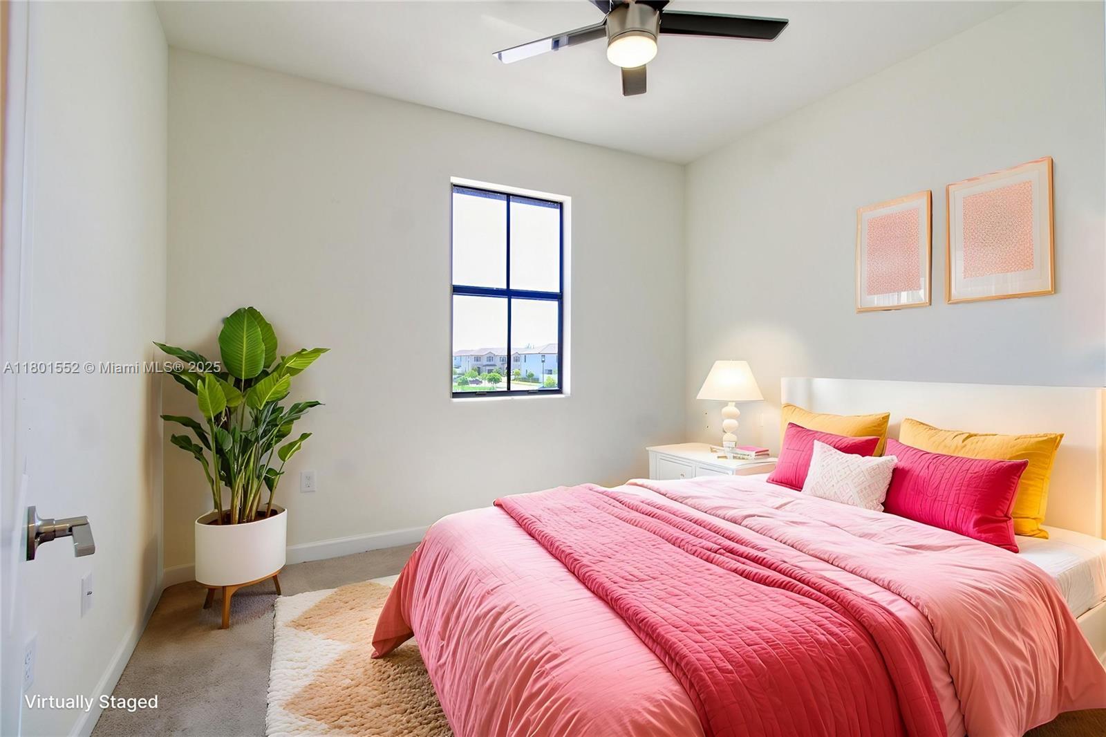 11094 West 33rd Way Hialeah, FL 33018 - Photo 27 of 46 a bedroom with a bed and a potted plant