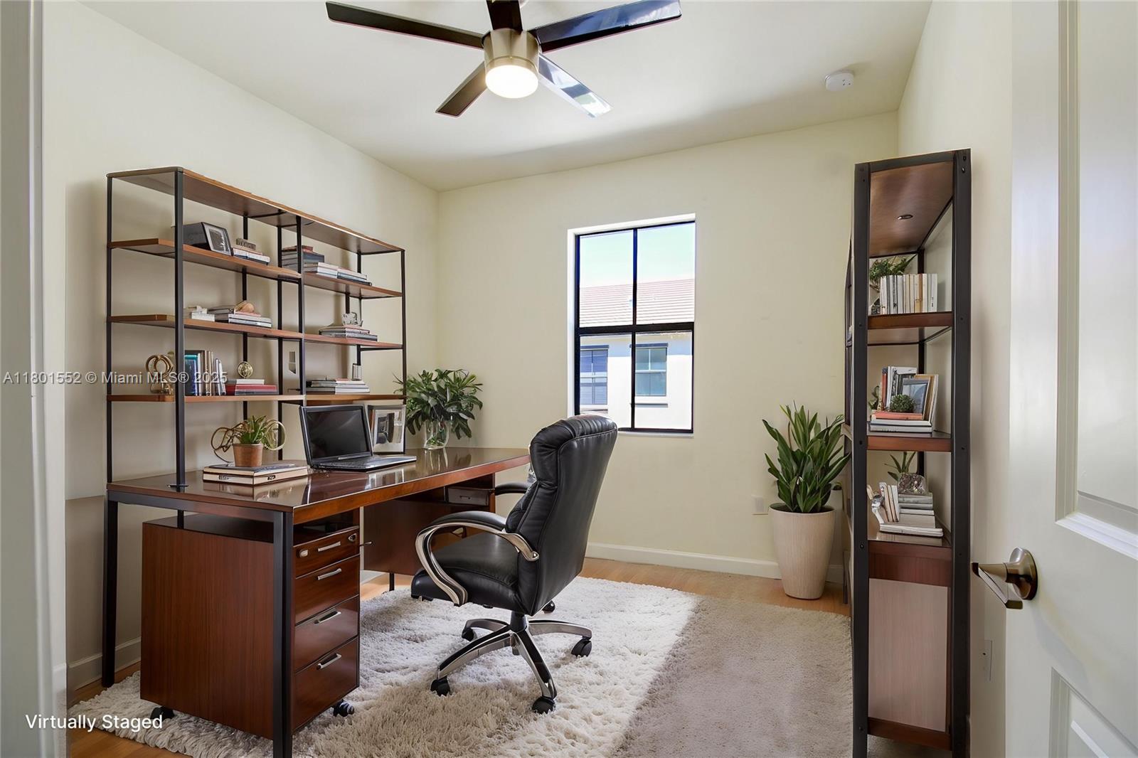 11094 West 33rd Way Hialeah, FL 33018 - Photo 30 of 46 a view of a workspace with furniture and a potted plant