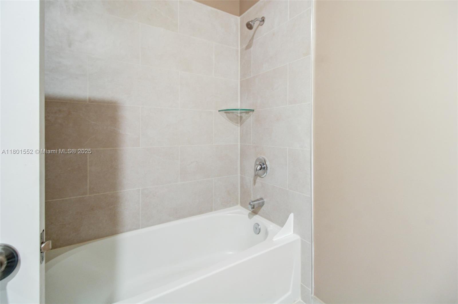 11094 West 33rd Way Hialeah, FL 33018 - Photo 33 of 46 a bathroom with a bathtub