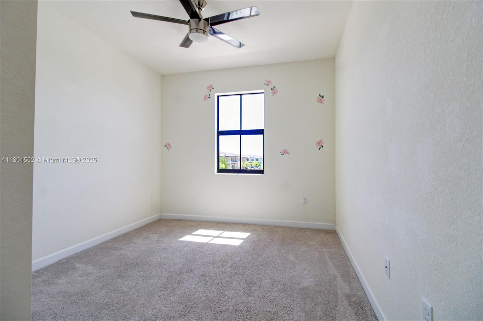 11094 West 33rd Way Hialeah, FL 33018 - Photo 34 of 46 an empty room with windows and fan