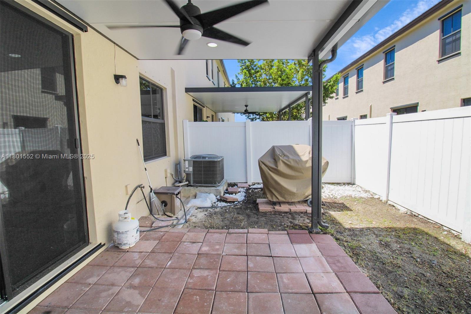 11094 West 33rd Way Hialeah, FL 33018 - Photo 40 of 46 a view of a porch with chairs and a yard